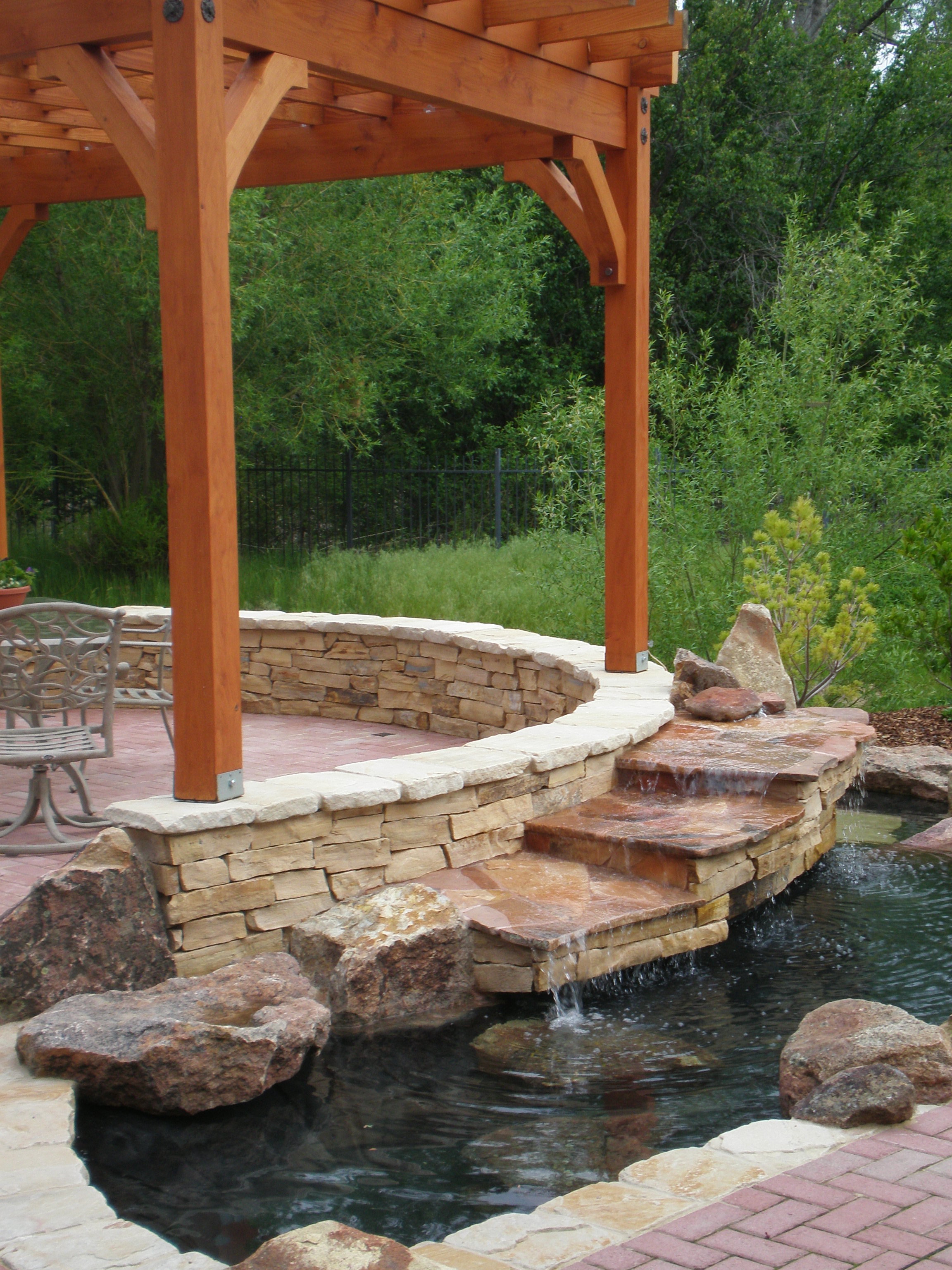 Pergola with Stepped Waterfall | The Garden Artist Boise, ID